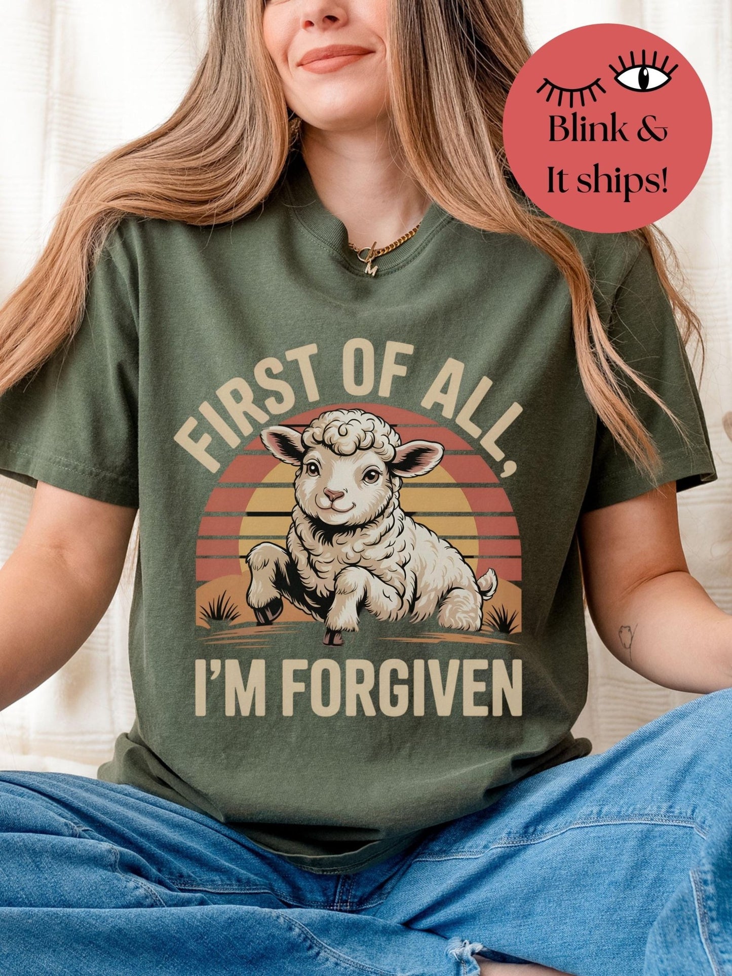 a woman wearing a green shirt with a picture of a sheep on it
