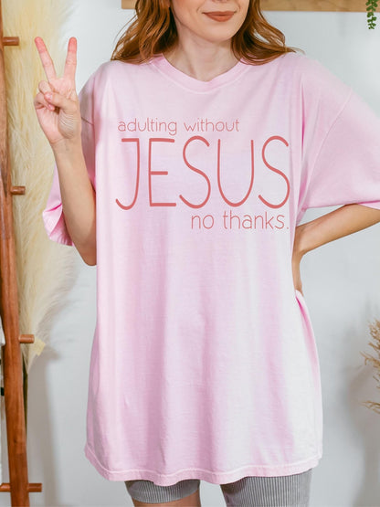 Christian graphic tee featuring Adulting Without Jesus design printed on Comfort Colors shirt perfect for faith based style and inspirational gift for her or him