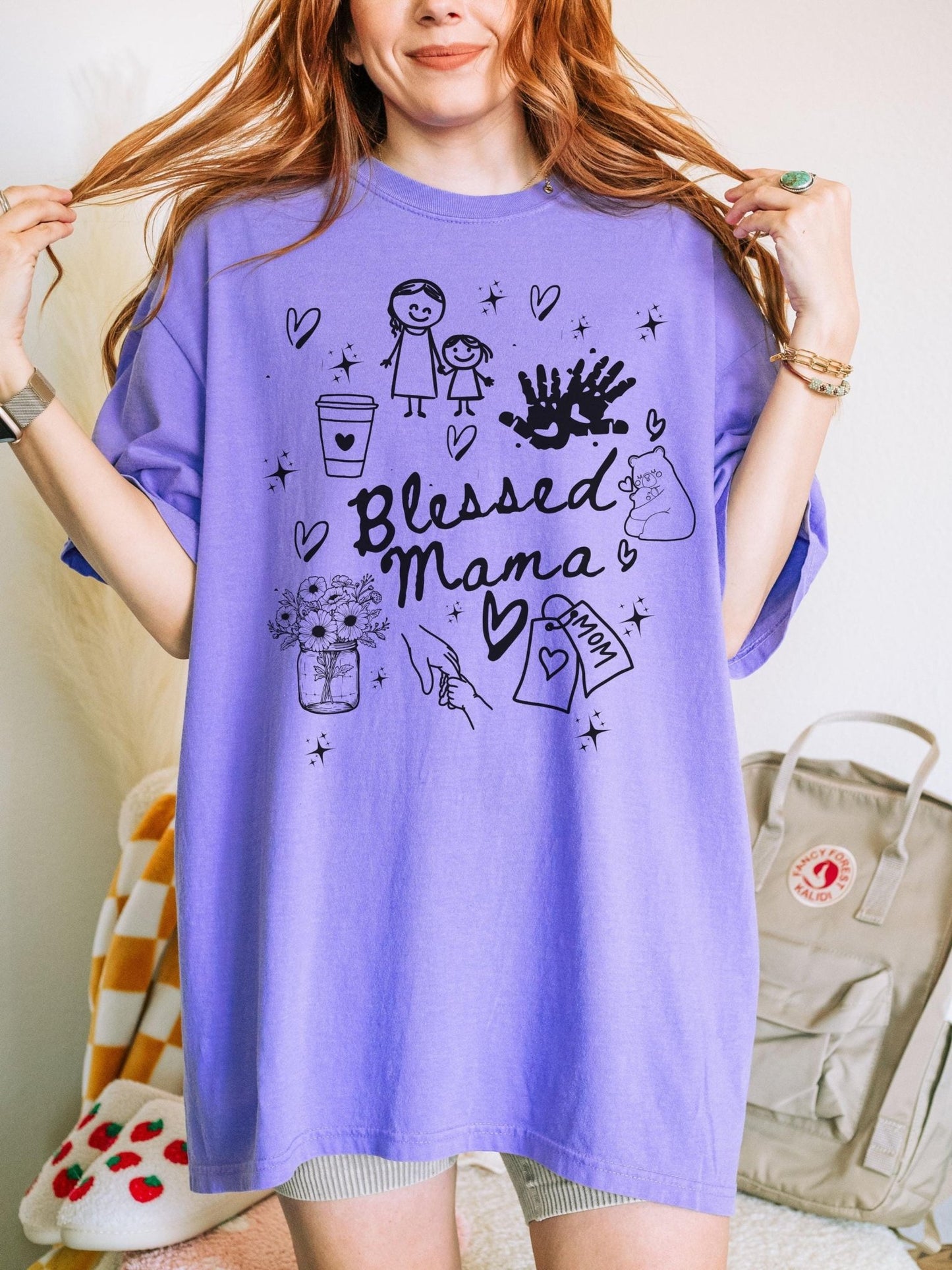 Doodle mama shirt featuring sweet icons like handprints and flowers, a thoughtful gift for Mother’s Day, mom appreciation events, or just because she’s the best