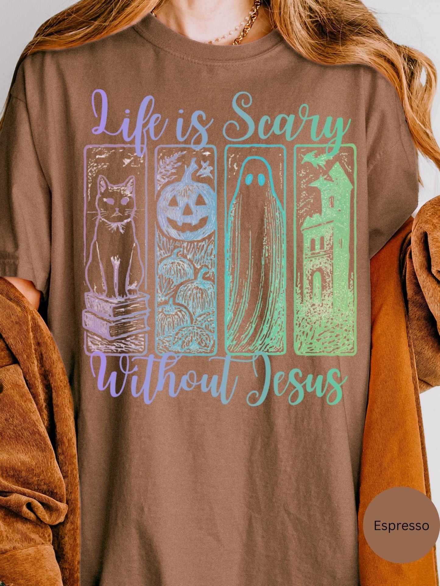 a brown t-shirt with a graphic design that includes a cat, a jack-o-lantern, a ghost, and a castle. The text on the t-shirt reads &quot;Life is scary without Jesus&quot;.