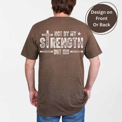 Christian men’s shirt with distressed faith design proclaiming Not by My Strength but His ideal for workouts prayer groups or family gatherings