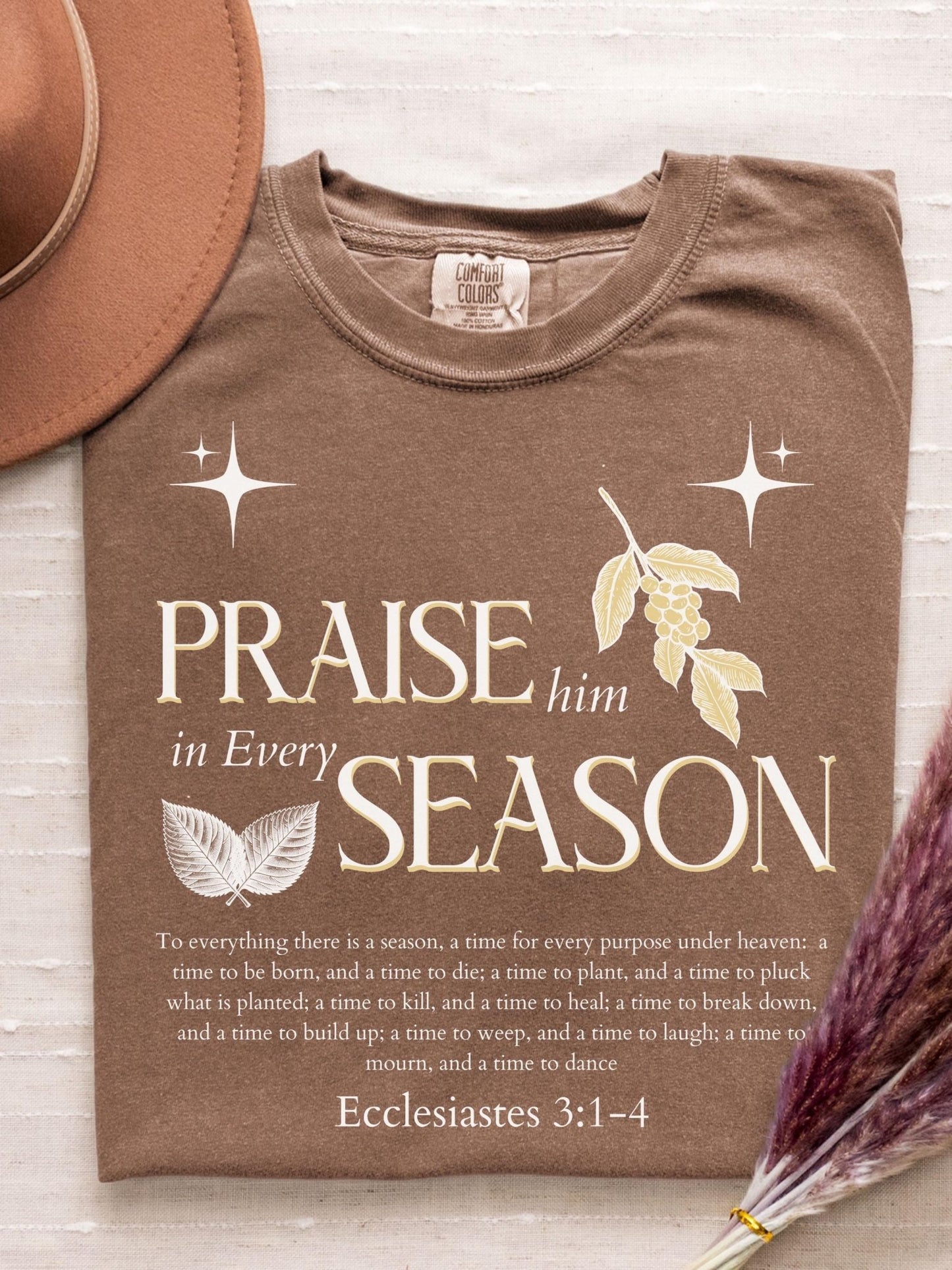 Bible verse tee with Praise Him in Every Season message printed on a soft Comfort Colors shirt perfect for believers and women who appreciate meaningful scripture fashion