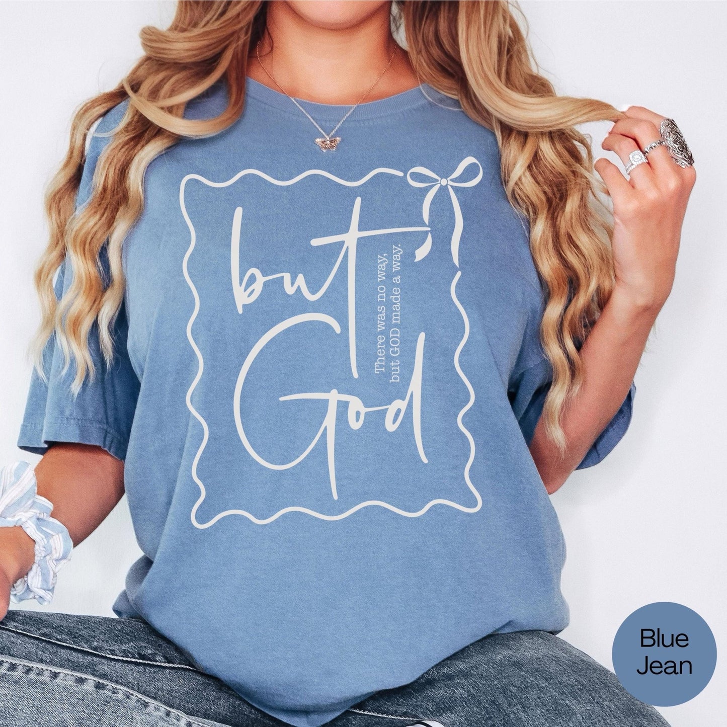 Coquette-style Bible verse t-shirt for her, featuring But God print and feminine bow detail, uplifting Christian gift for women and teens