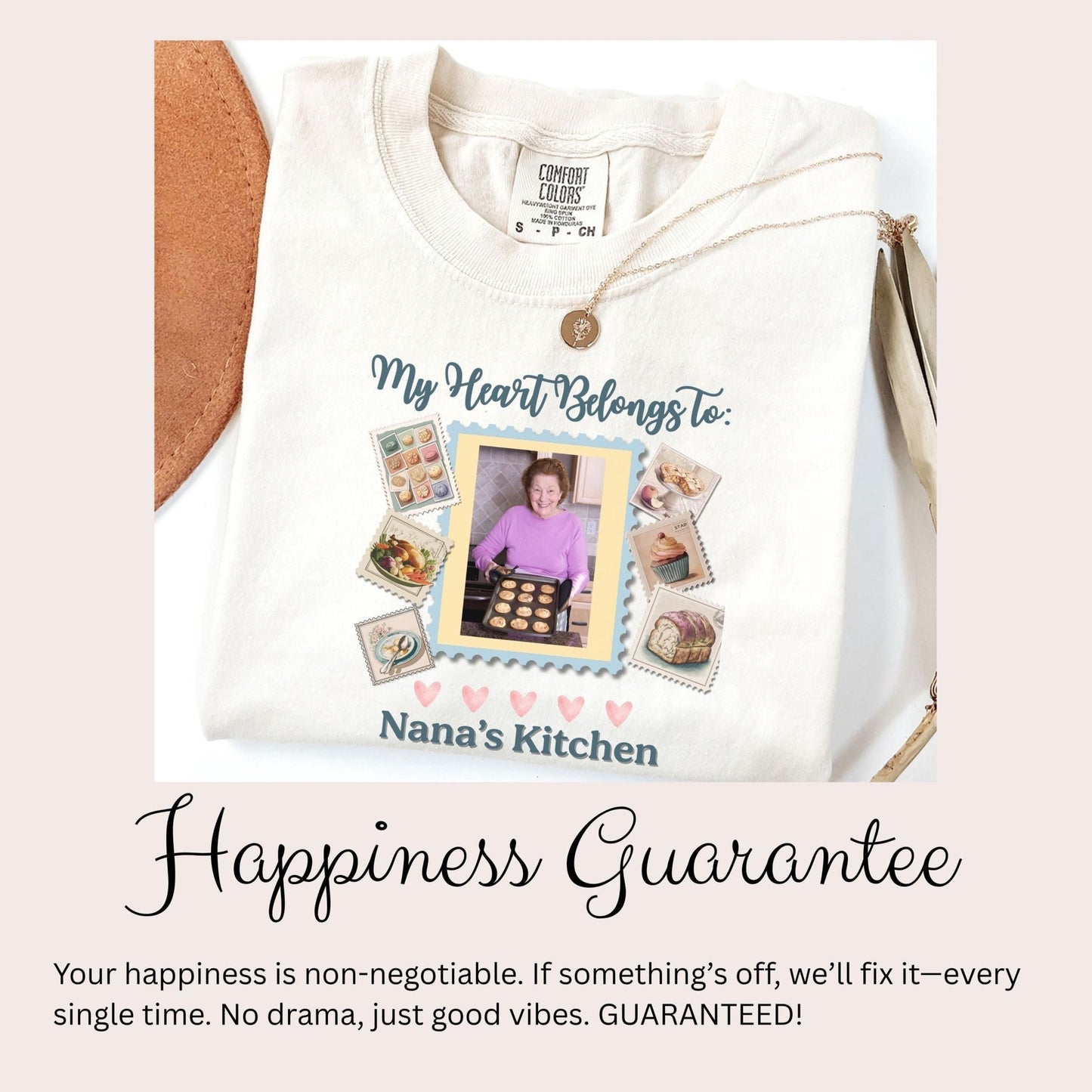 a white t-shirt with a personalized design, including a photo of a woman and various food items. The text on the t-shirt reads &quot;My Heart Belongs to: Nana&#39;s Kitchen&quot; and &quot;Happiness Guarantee&quot;.
