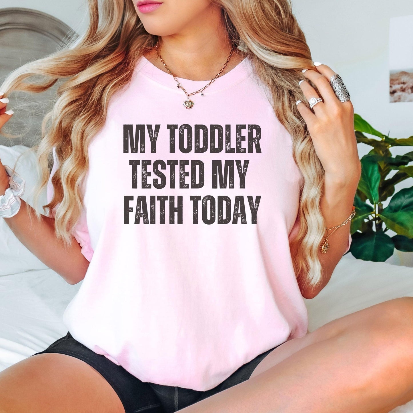 This funny mom shirt with “My Toddler Tested My Faith Today” is a perfect cute mom life t-shirt for women looking for humor in parenting and a trendy Christian faith-based outfit for everyday wear