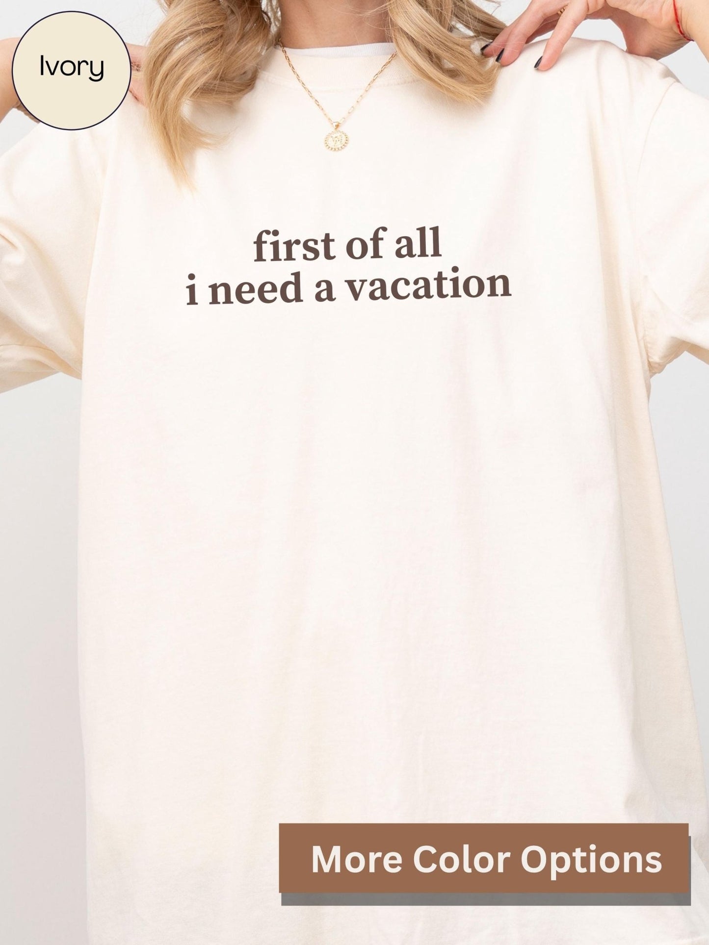 A person wearing a white t-shirt with the text "first of all I need a vacation" printed on it.