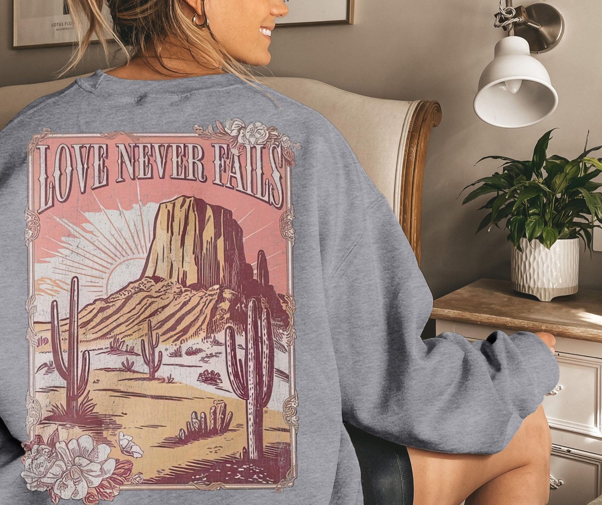 Faith-based sweatshirt with hand-drawn desert landscape