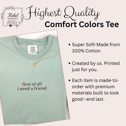 a light green t-shirt with the text &quot;first of all I need a friend&quot; printed on it.