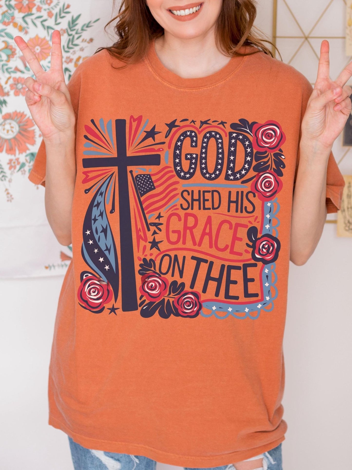 American flag and floral tee for women of faith celebrating liberty and grace through patriotic colors and cross-inspired artwork
