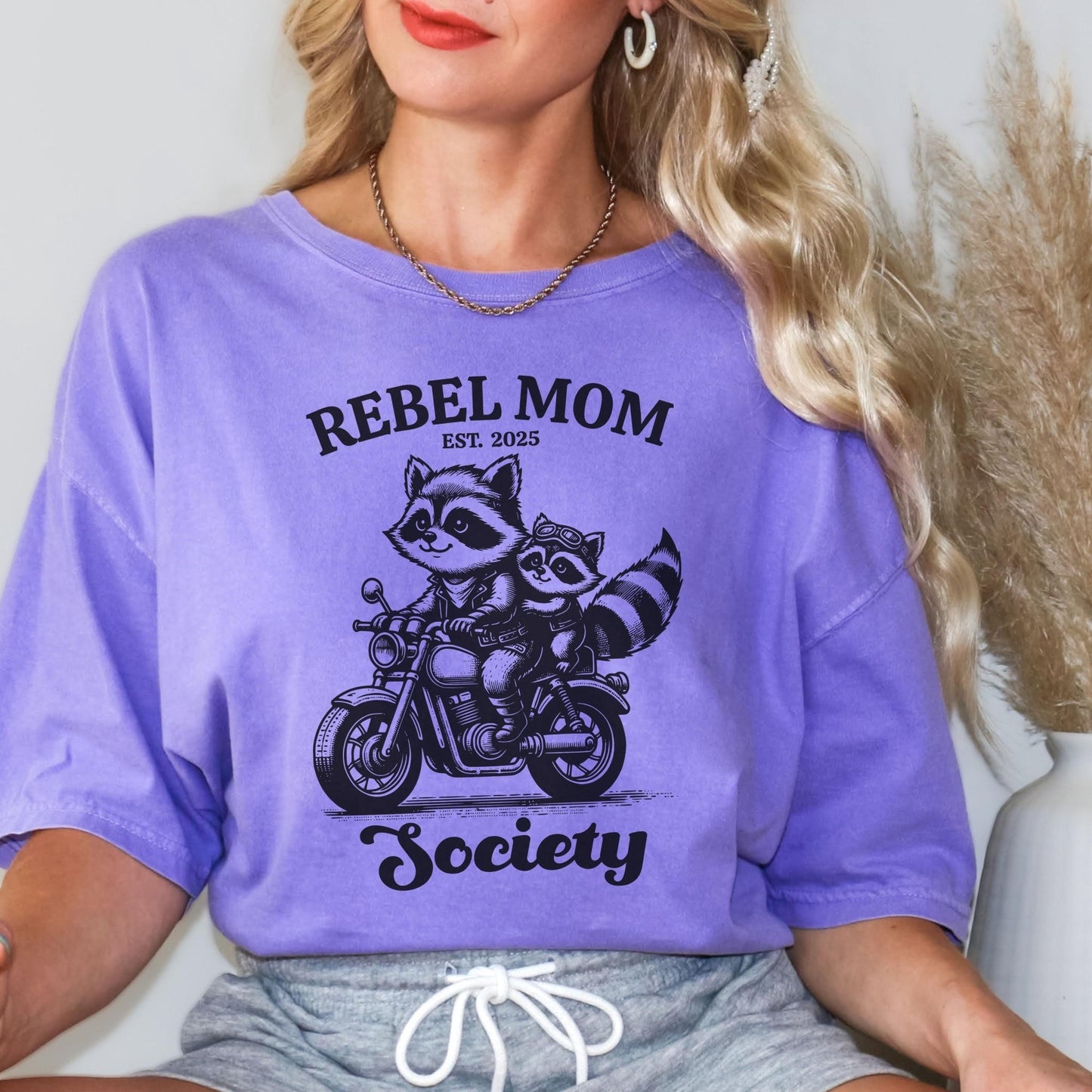 Stylish biker mom outfit featuring a vintage aesthetic and bold mom life message, making it a fun and thoughtful gift for any rebellious and adventurous mama