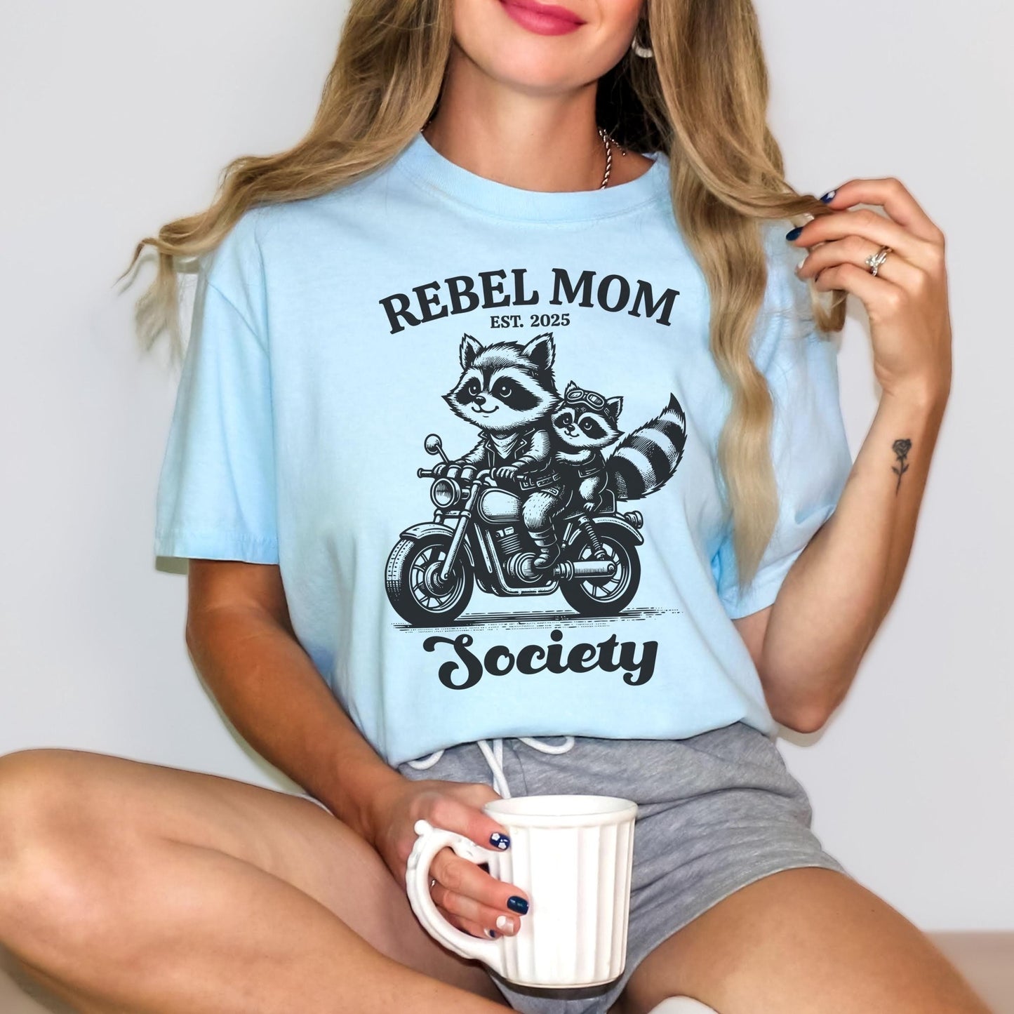 Funny biker mom t-shirt with a vintage-inspired raccoon design, perfect for moms with a rebellious spirit looking for a stylish and edgy mom life shirt