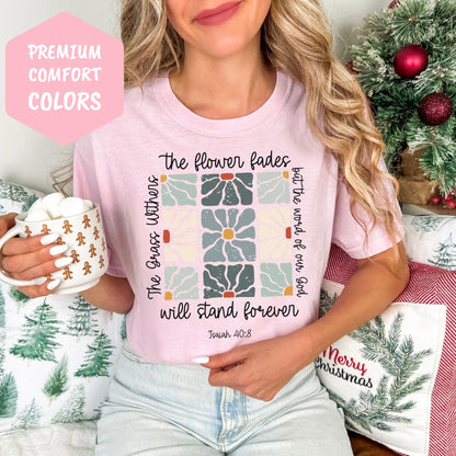 a woman wearing a pink shirt holding a cup of coffee