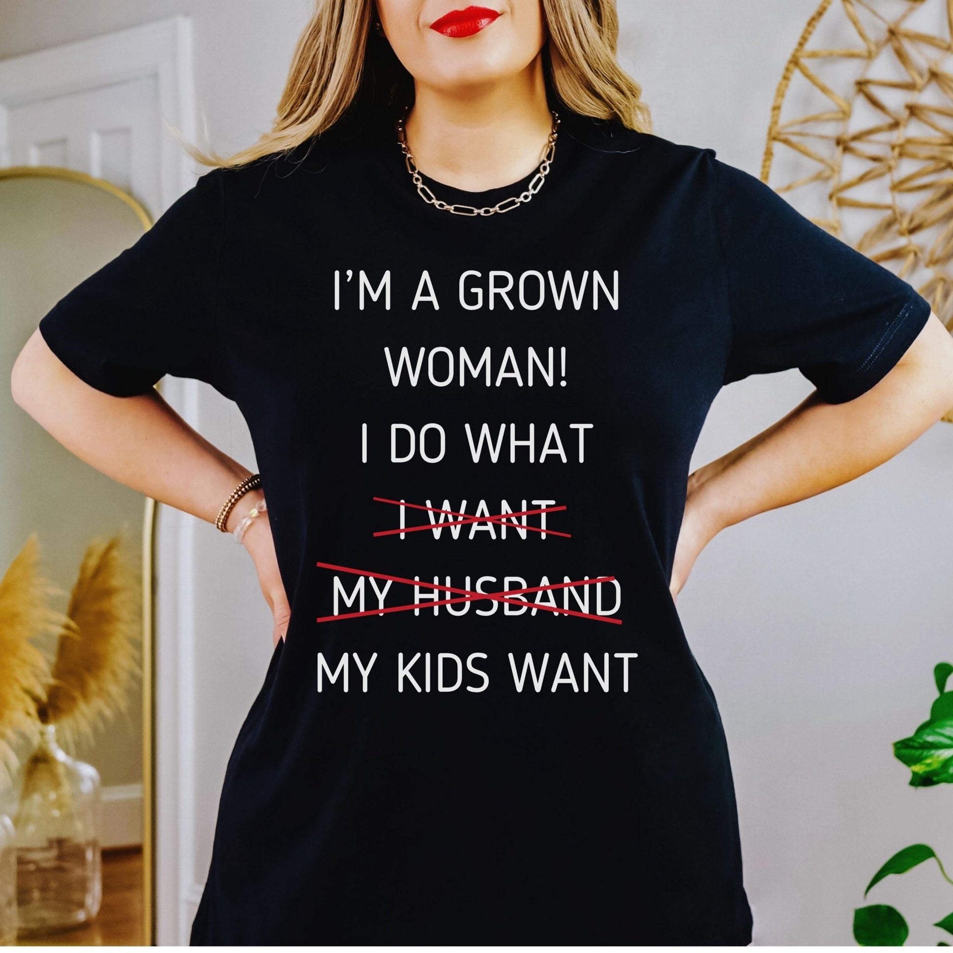 A funny grown woman t shirt that says I do what my kids want ideal for mothers day gift from kids featuring a snarky mom life quote in a bold graphic tee style for casual wear