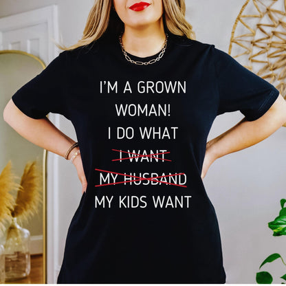 A funny grown woman t shirt that says I do what my kids want ideal for mothers day gift from kids featuring a snarky mom life quote in a bold graphic tee style for casual wear