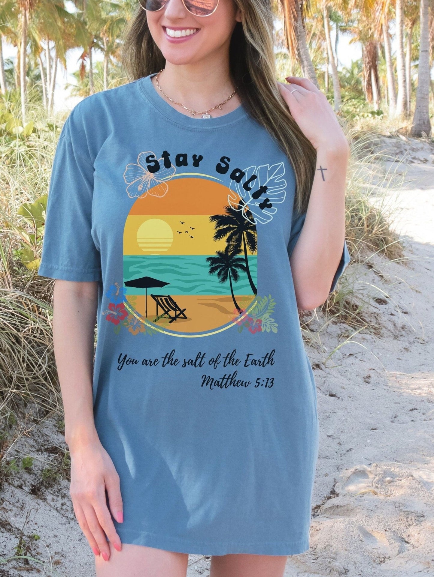 Spread inspiration with this Christian t-shirt featuring the Bible verse Matthew 5:13, Stay Salty. Ideal for vacation, beach, or casual wear, this Comfort Colors shirt offers both faith and fashion in one.