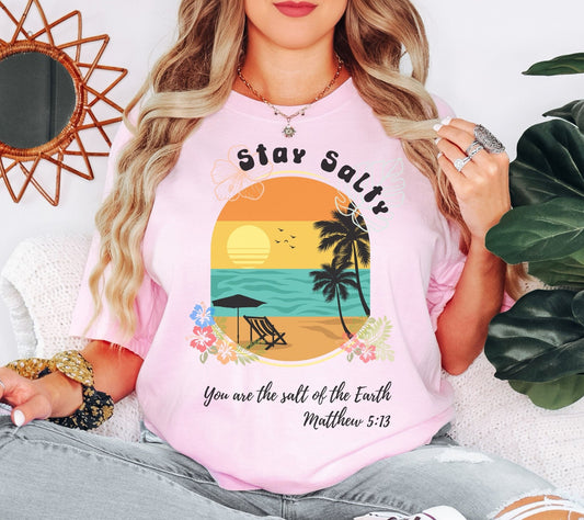 Stay Salty Christian t-shirt inspired by Matthew 5:13, perfect for vacations, beach outings, and casual wear. This faith-based tee is a great way to express your beliefs with a fun and stylish summer graphic.