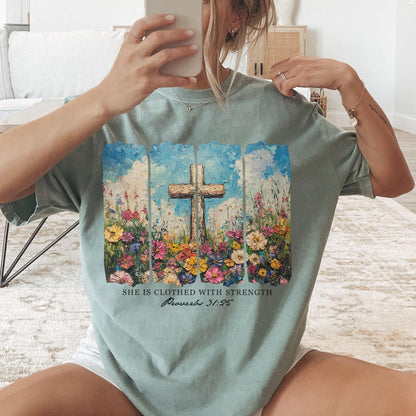 Beautiful floral cross t-shirt with She Is Clothed With Strength Bible verse perfect for Christian gifts and faith-based fashion